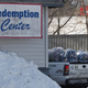A truck pulls up to a bottle redemption center in Maine.